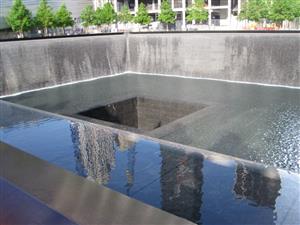 The memorial pool brings a bit of peace and tranquility to the 9/11 Memorial in NYC.